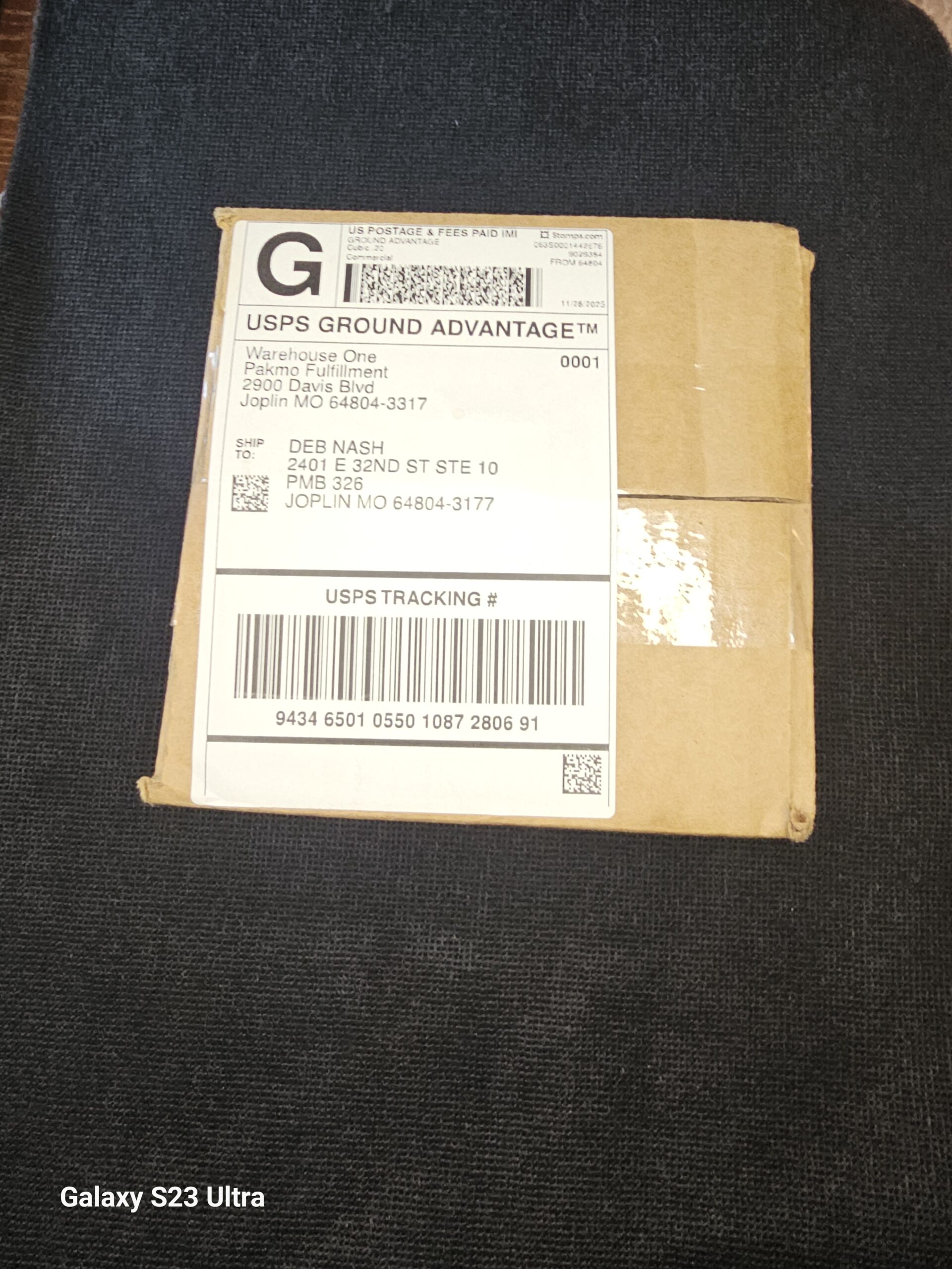 Unopened Pinnacle Hemp shipping box on a dark background