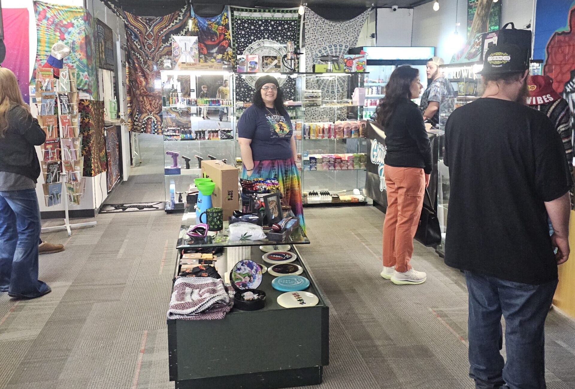 Alt text: Grateful Headz grand opening crowd inside storefront